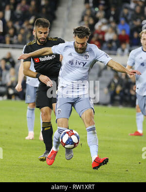 Los Angeles, California, USA. 3rd Mar, 2019. Sporting Kansas City defender Graham Zusi (8) controls the ball away from Los Angeles FC forward Diego Rossi (9) of Uruguay during the 2019 Major League Soccer (MLS) match between Los Angeles FC and Sporting Kansas City in Los Angeles, California, March 3, 2019. Credit: Ringo Chiu/ZUMA Wire/Alamy Live News Stock Photo