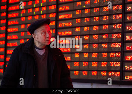 Nanjing, China's Jiangsu Province. 4th Mar, 2019. An investor is seen at a stock exchange in Nanjing, capital of east China's Jiangsu Province, March 4, 2019. Chinese shares close higher Monday, following MSCI's decision to increase the weight of China A-shares in its indexes and the newly unveiled regulations on the sci-tech board. The benchmark Shanghai Composite Index gained 1.12 percent to finish at 3,027.58, breaking through the 3,000-point level. Credit: Su Yang/Xinhua/Alamy Live News Stock Photo