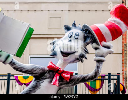Mobile, Alabama, USA. 4th March, 2019. A Mardi Gras float featuring the Cat in the Hat from Dr. Seuss travels down Royal Street during the Floral Parade, March 4, 2019, in Mobile, Alabama. The theme of this year’s parade was “Throw Me a Book,” with 16 floats featuring classic characters from children’s books. Mobile’s first official Mardi Gras celebration was recorded in 1703. Mardi Gras originated as a French tradition of feasting and revelry before the austere Catholic Lent. Credit: Carmen K. Sisson/Cloudybright/Alamy Live News Stock Photo