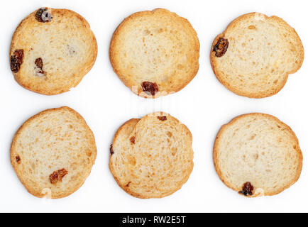 Mini round toasts of bread with raisins. 6 units. Isolated on white background. Stock Photo