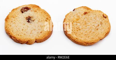 Mini round toasts of bread with raisins. 2 units. Isolated on white background. Stock Photo