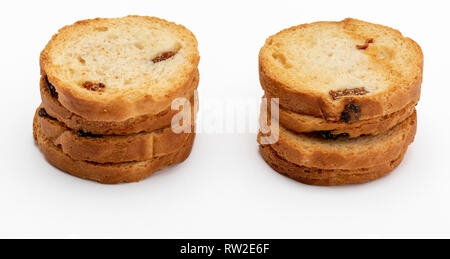 Mini round toasts of bread with raisins. Several units. Isolated on white background. Stock Photo