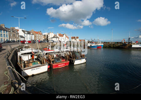 Fishing trawlers moored in the beautiful harbour  at Pittenweem in Fife on the east coast of Scotland Stock Photo