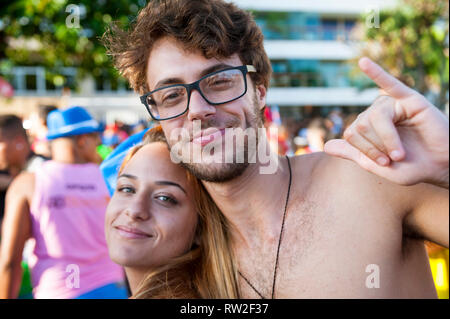 RIO DE JANEIRO - FEBRUARY 11, 2017: Young Brazilians celebrate Carnival at a crowded afternoon street party on the Ipanema beachfront. Stock Photo