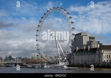 London, England - February 28, 2019: London Eye or Millennium Wheel on South Bank of River Thames in London England, UK Stock Photo