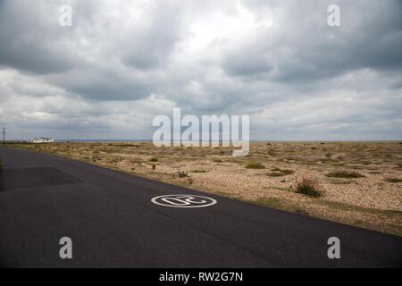 Lonely Road in Bleak Landscape No cars, Dungeness Kent Stock Photo