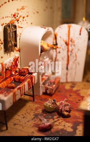 Close up of a diorama of a murder and body parts, on display at the Peculiarium in Portland, Oregon, USA. Stock Photo