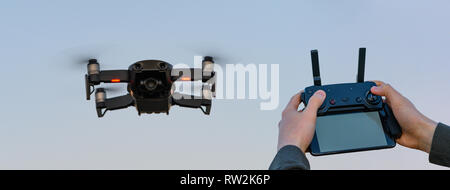 Drone in the sky with remote controller Stock Photo