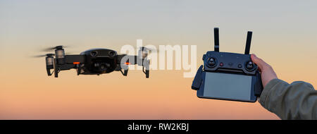 Drone in the sky with remote controller Stock Photo