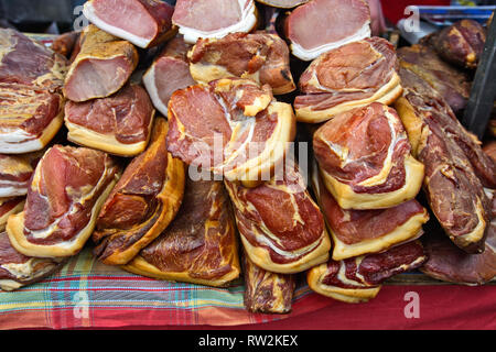 Various products from dried meat exposed to view and tasting before sale. Stock Photo