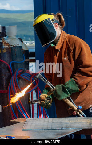 Trainee divers practise their skills in all aspects of the trade from welding to diving plus buddying.Fort William Scottish Highlands Scotland UK Stock Photo