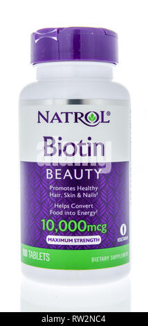 Winneconne, WI - 21 February 2019: A bottle of  Natrol Biotin supplement on an isolated background Stock Photo