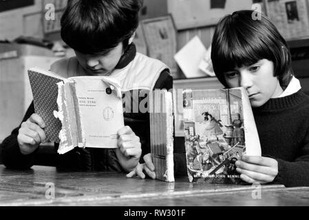 Education: Lack of text books in the early 1980's led to school children having to share books. Books were repaired many times and were only replaced when they could not be read. March 1981 PM 81-01143-001 Stock Photo