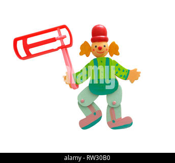 wooden colorful clown and plastic noisemaker or gragger for purim celebration holiday (jewish holiday) isolated on white Stock Photo