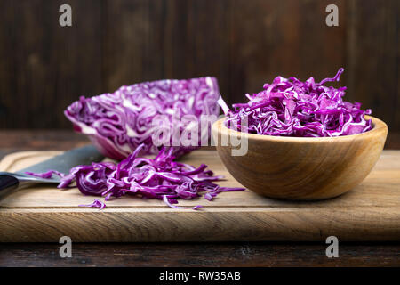 finely chopped purple cabbage in a plate on the table. fresh vitamin salad Stock Photo