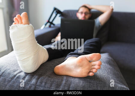 Convalescence at home after breaking the leg Stock Photo