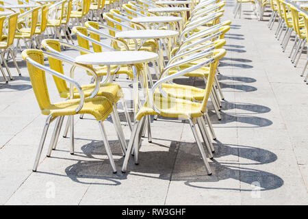 Cafe chairs and tables in San Marco square in Venice Stock Photo