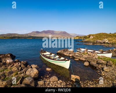 Two boats on the shore of Lough Currane near Waterville on the Ring of Kerry Stock Photo