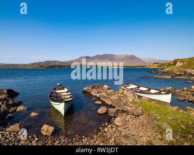 Two boats on the shore of Lough Currane near Waterville on the Ring of Kerry Stock Photo