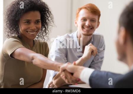 Happy african hr handshake candidate at team meeting job interview Stock Photo