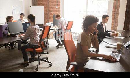 Diverse staff employees group working on computers in modern office Stock Photo