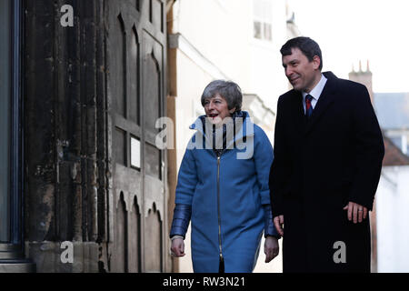 Prime Minister Theresa May walks with local Conservative MP John Glen in Salisbury, Wiltshire, where she is meeting with local businesses on the first anniversary of the Skripal poisoning in Salisbury. Stock Photo