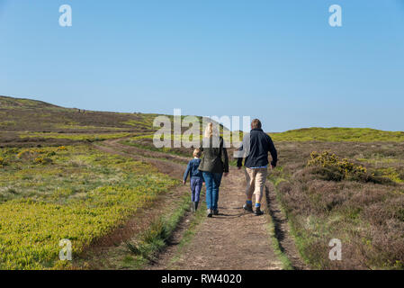 Family walking on the moors at Castleton Rigg, Westerdale, North York Moors national park, England. Stock Photo