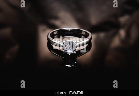 Ring on the black mirror surface Stock Photo