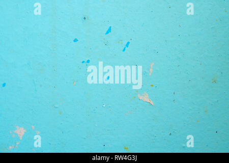 Peeling Blue Aquamarine Color Paint from the Wall. Shattered Plaster Background Stock Photo