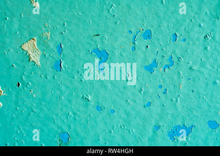 Peeling Blue Aquamarine Color Paint from the Wall. Shattered Plaster Background Stock Photo