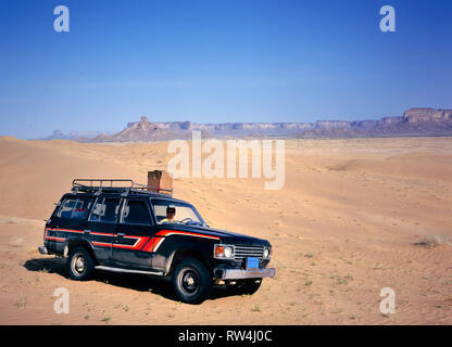 Marib,Yemen-September 18, 2013: Fourwheeldrive in the desert East from Marib in Yemen with woman driving. Stock Photo