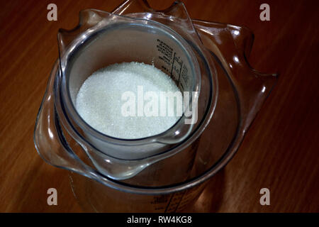 Sugar  in a measuring cup Stock Photo