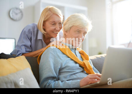 Contemporary Senior Man Using Laptop Stock Photo