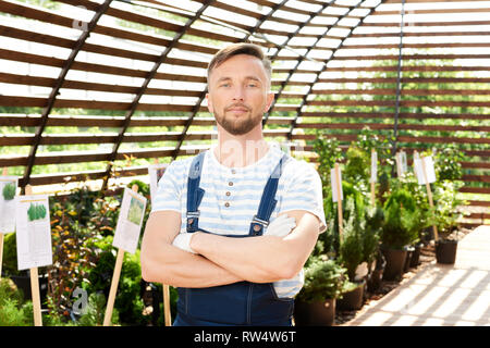 Handsome Worker in Garden Stock Photo