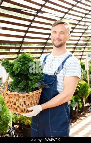 Smiling Worker in Garden Stock Photo