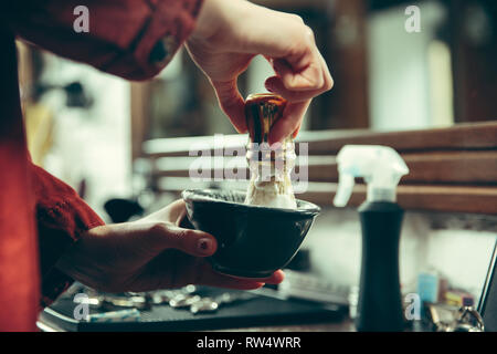 Barbershop. Female barber at salon. Gender equality. Woman in the male profession. Hands close up Stock Photo