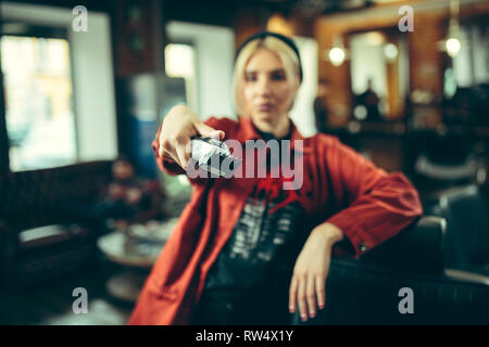 Barbershop. Female barber at salon. Gender equality. Woman in the male profession. Hands close up Stock Photo