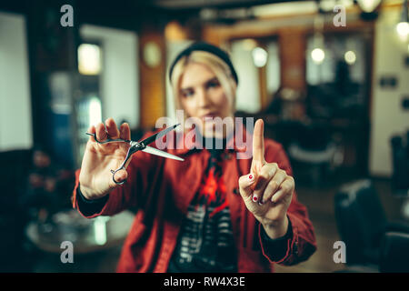 Barbershop. Female barber at salon. Gender equality. Woman in the male profession. Hands close up Stock Photo