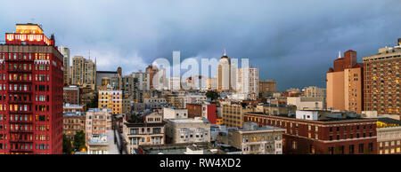 Cityscape of apartment and office towers under a cloudy sky. Stock Photo