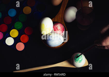 Crop hand painting Easter egg Stock Photo