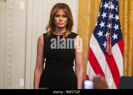 First Lady Melania Trump looks on as U.S. President Donald Trump speaks at a National African American History Month reception at the White House in Washington, D.C., U.S., on Thursday, Feb. 21, 2019. Stock Photo