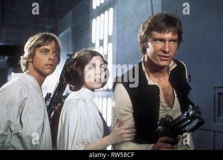 HAMILL,FISHER,FORD, STAR WARS: EPISODE IV - A NEW HOPE, 1977 Stock Photo