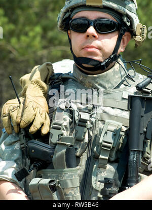 U.S. soldier in camouflage uniform with his rifle. Stock Photo