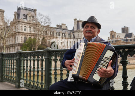 Close up portrait of the accordion player from Notre Dame, Paris. Stock Photo