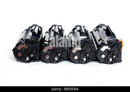 Three Used cartridges for laser printer isolated on white background. Stock Photo