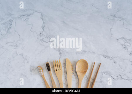 Bamboo wood toothbrush on clean white marble table top view background concept for save the earth day, world environmental, plastic free, kitchen flat Stock Photo