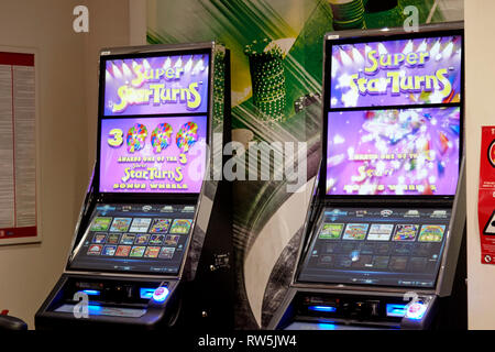 fixed odds betting terminals inside a betting shop Stock Photo