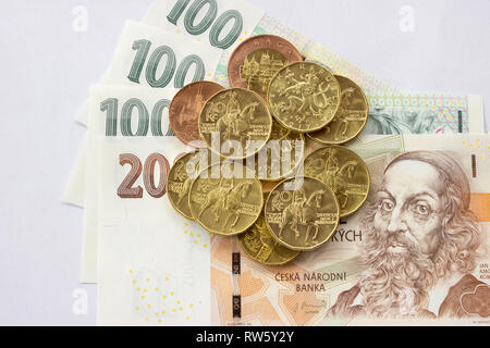 Czech coin on the various Czech banknotes money like background. Hundred crowns, two hundred crowns, twenty crowns coins Stock Photo
