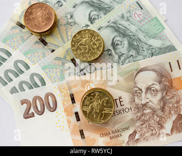 Czech coin on the various Czech banknotes money like background. Hundred crowns, two hundred crowns, twenty crowns coins, ten Stock Photo