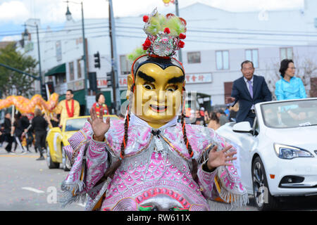LOS ANGELES - FEBRUARY 9, 2019:  Costumed and Masked Character at the Los Angeles Golden Dragon Parade, celebrating the Chinese New Year Stock Photo